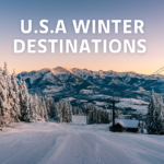 Snow-covered ski resort in the USA with gondola lift, evergreen trees, and mountain peaks at sunset.