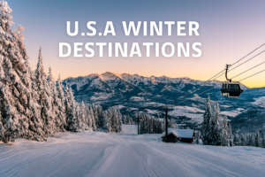 Snow-covered ski resort in the USA with gondola lift, evergreen trees, and mountain peaks at sunset.